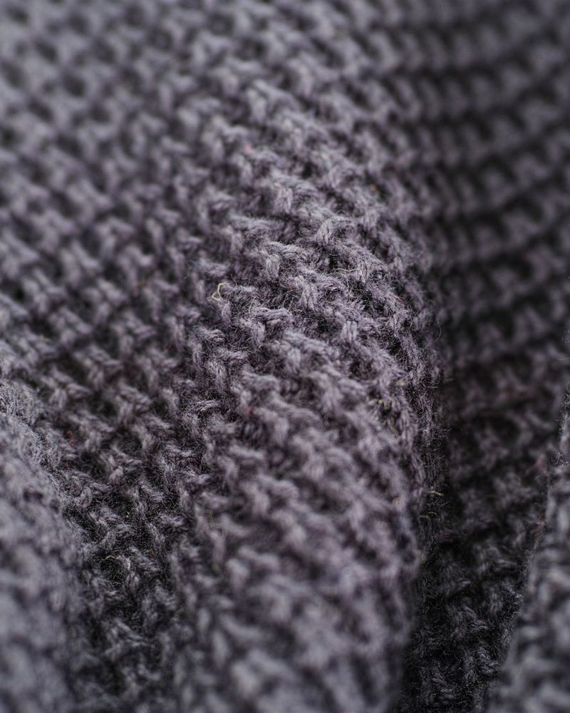 Gros plan d’un tissage de laine gris